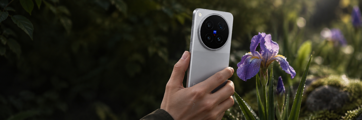 Earth Echo Vivo X500 Pro Max held close to a dew-covered iris for telephoto macro photography.