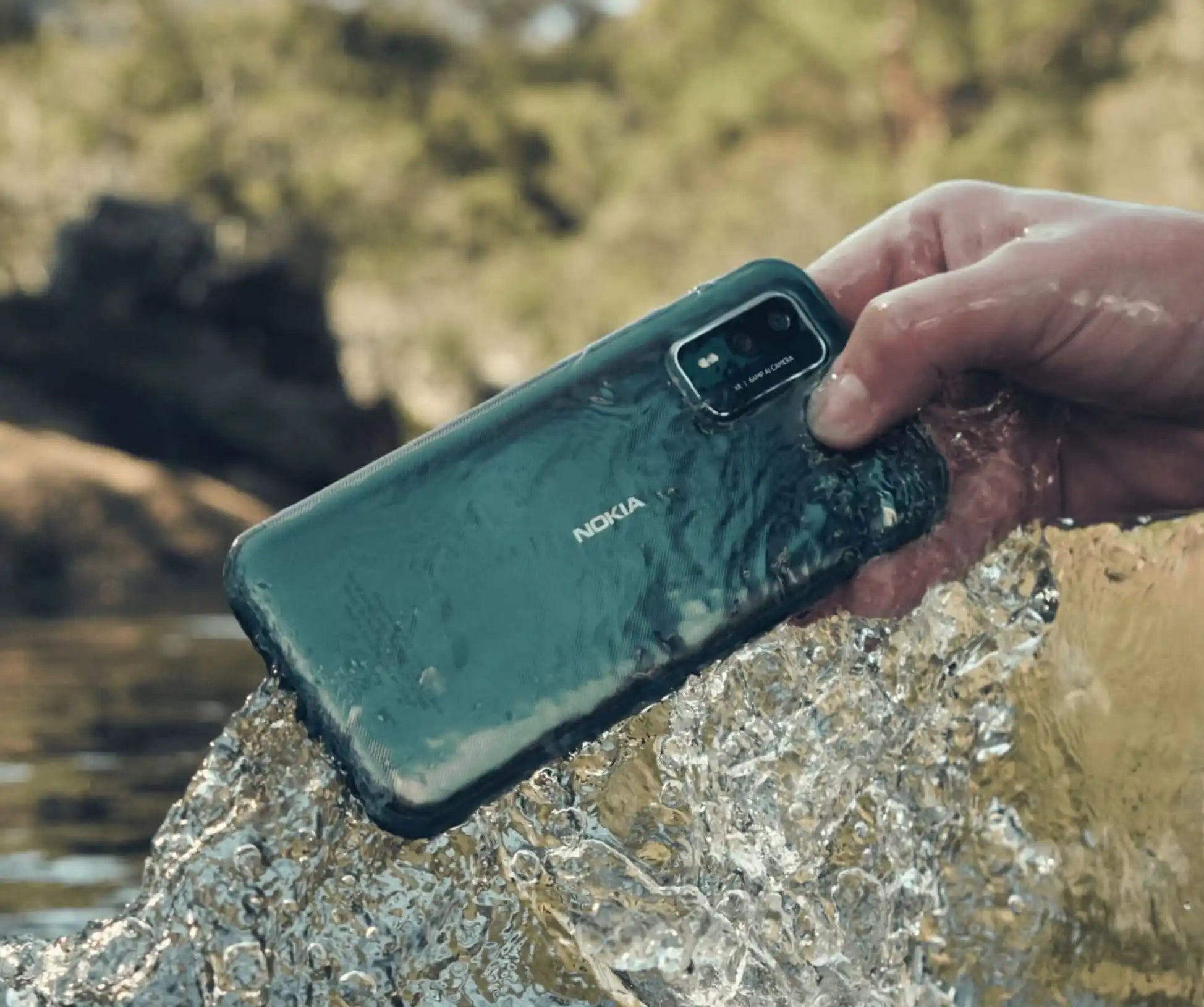 Dark green Nokia smartphone with water droplets on its surface.