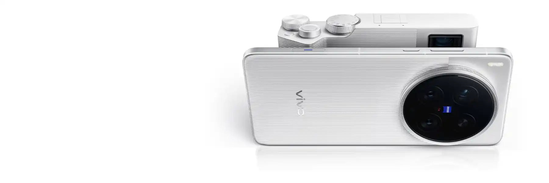 A white, sleek digital camera with a large lens.